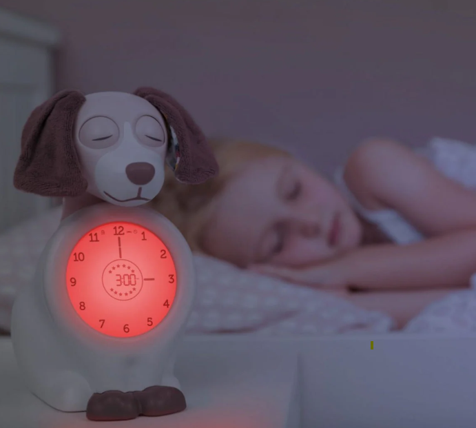 Child sleeping with Davy the Dog Sleep Trainer Alarm Clock